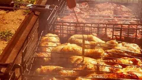 Check the readiness of Chicken legs on the grill Stock Footage 76408043