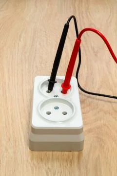 Check the socket for serviceability using the tester. Stock Photos