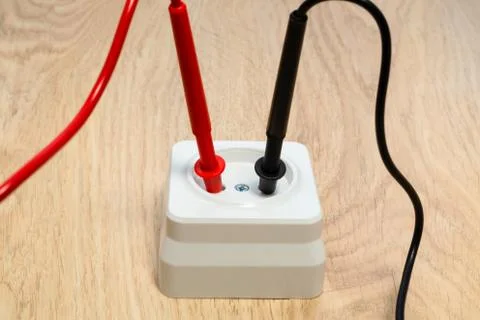 Check the socket for serviceability using the tester. Stock Photos