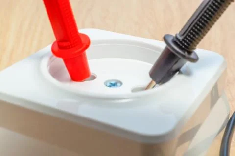 Check the socket for serviceability using the tester. Stock Photos