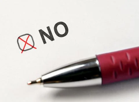 Checkbox NO. marked with red cross and pen on white paper background. Check.. Stock Photos