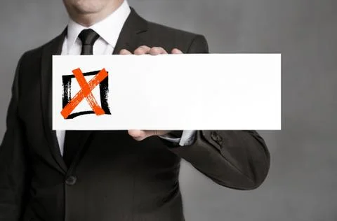 Checkbox with shield held by businessman Stock Photos