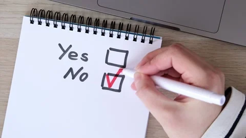Checkboxes Yes and No, the answer is No. Red marker in the hand. Empty boxes for Stock Footage 231137551