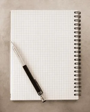 Checked notebook at metal background Foto stock
