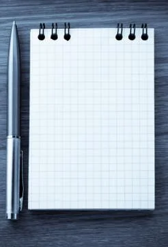 Checked notebook on wood Stock Photos