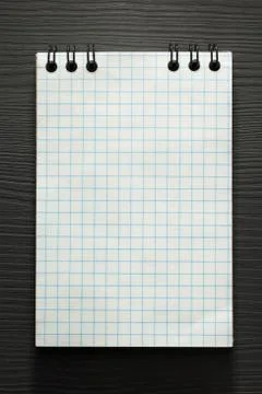 Checked notebook  on wood Stock Photos