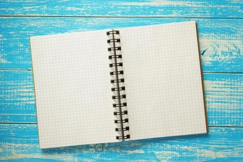 Checked notebook on wood Stock Photos