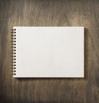 Checked notebook at wood Foto stock