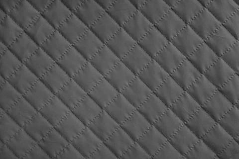 Checkered, diamond stitching pattern, black quilted fabric background. Blan.. Foto stock