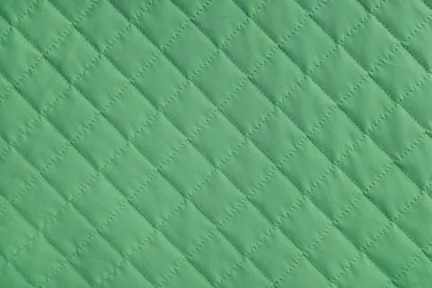Checkered, diamond stitching pattern, green quilted fabric background. Blan.. Stock-Fotos
