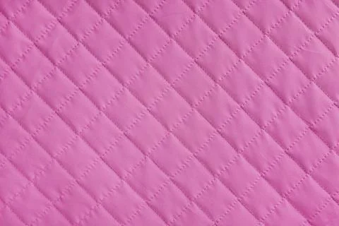 Checkered, diamond stitching pattern, pink quilted fabric background. Blank.. Stock-Fotos