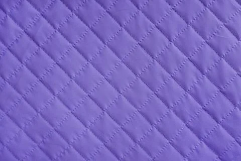 Checkered, diamond stitching pattern, purple quilted fabric background. Bla.. Stock-Fotos