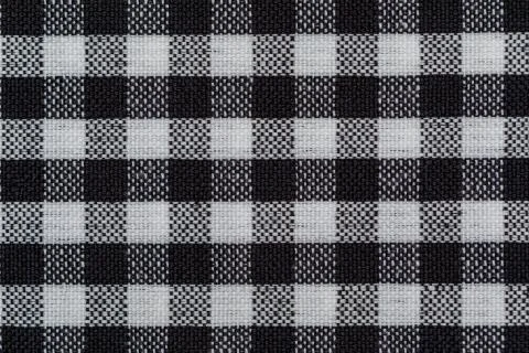 Checkered fabric background. Black cell. Top view, flat lay. Stock Photos