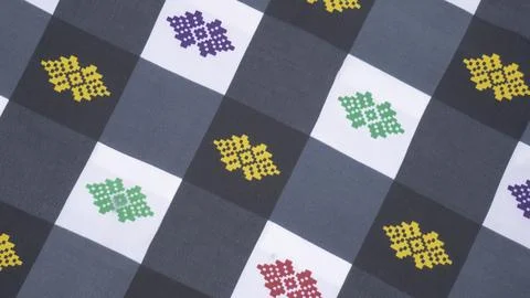 Checkered Fabric Pattern With Colorful Decorative Motifs Stock Photos