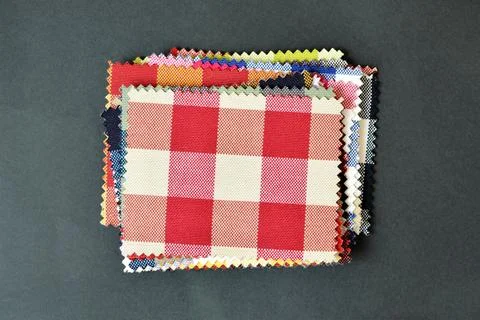 Checkered fabric pattern samples on black background Stock Photos
