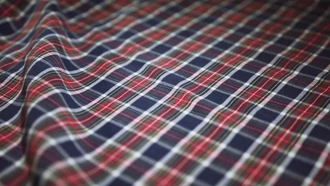 Checkered fabric with a wavy fold texture. use as background. close-up Video stock 81258639