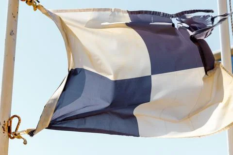 Checkered flag attached to pole Stock Photos