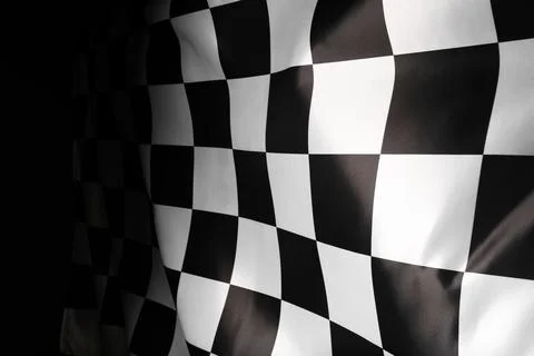 Checkered flag on black background, closeup view Illustrazione stock