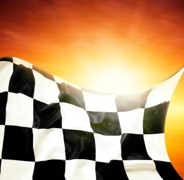 Checkered flag in front of bright sky Stock Photos