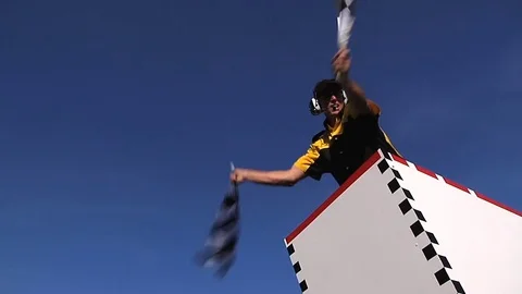 Checkered Flag Man (wider view) 스톡 동영상 72234266