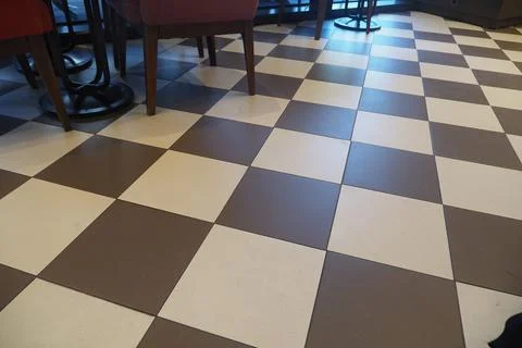 Checkered floor pattern in a cozy cafe setting Fotos de archivo