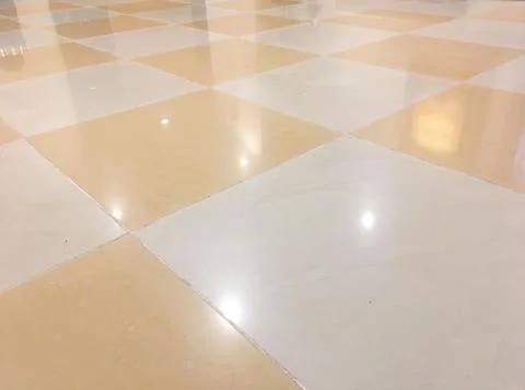 A checkered floor with a shiny surface. Stock Photos