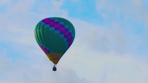 Checkered hot air balloon floating Stock Footage 345536659