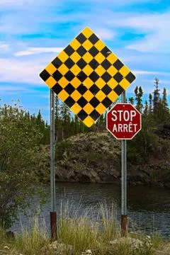 A checkered no entry and stop sign in both english and french Stock Photos