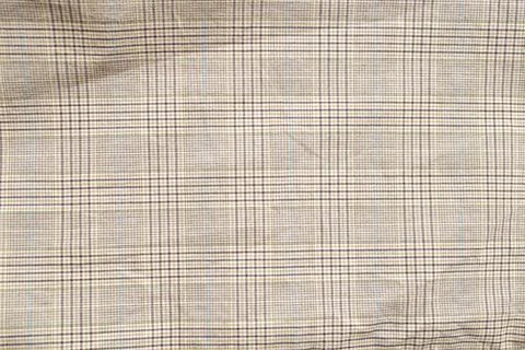 Checkered pattern on beige fabric, close up of textile texture Stock Photos