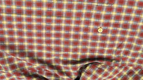 Checkered red and yellow down clothes shirt with button Stock Photos