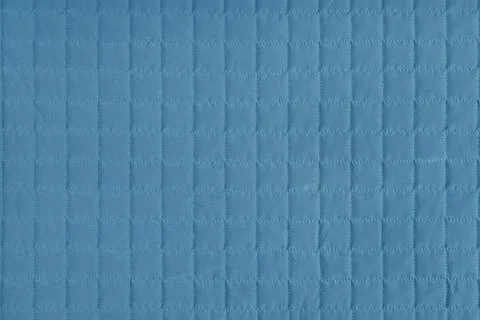 Checkered stitching pattern, blue quilted fabric background. Blanket stitch.. Stock Photos