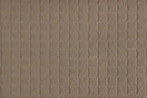 Checkered stitching pattern, brown quilted fabric background. Blanket stitc.. Stockfoto's