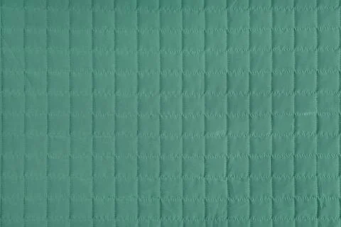 Checkered stitching pattern, green quilted fabric background. Blanket stitc.. Foto stock