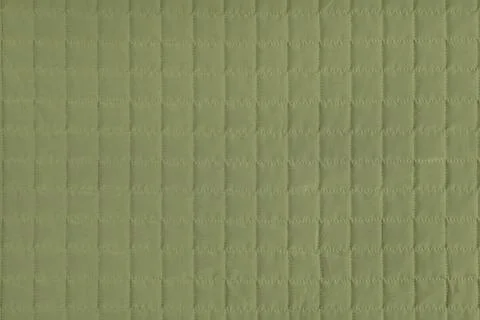 Checkered stitching pattern, khaki quilted fabric background. Blanket stitc.. Stock-Fotos
