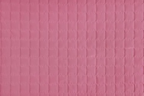 Checkered stitching pattern, pink quilted fabric background. Blanket stitch.. Stock Photos