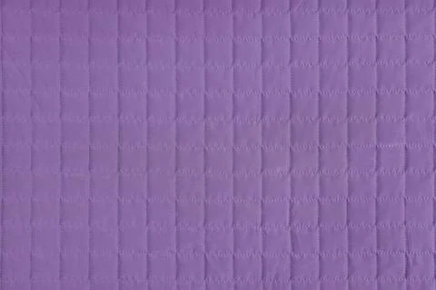 Checkered stitching pattern, purple quilted fabric background. Blanket stit.. Stock Photos