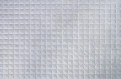 Checkered texture white fabric with mesh embossing. Abstract pattern, background Stock Photos