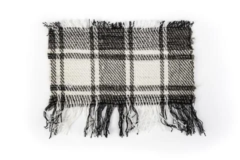 Checkered wool fabric ripped in rectangular shape on white background Stock Photos