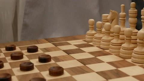 Checkers and chess spinning. side view Stock Footage 147441336