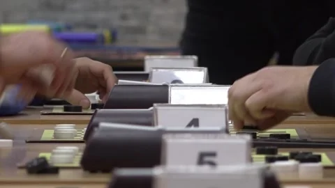 Checkers boards placed on tables during a game. 库存影片 332807405
