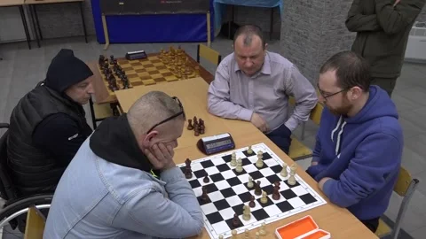 Checkers Game – Player Without Hands Assisted by Helper. Full Shot Stock Footage 332162136