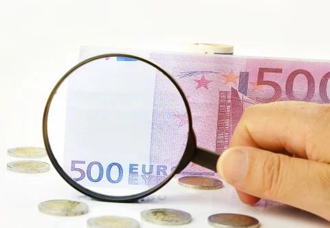 Checking 500 euro note with magnifying glass Stock Photos