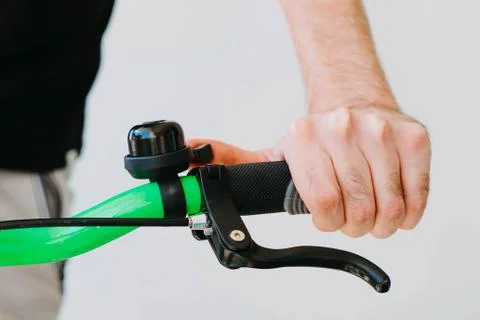 Checking the adjustment of the brake handle of the green fix bike Stock Photos
