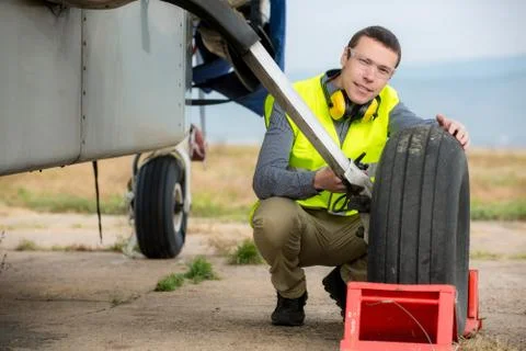 Checking aircraft's tire Stock Photos