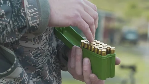 Checking the amount of ammunition in the package Stockbeeldmateriaal 243482831