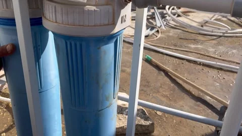 Checking and Maintaining Rooftop Water Filter Housings Video stock 345611673