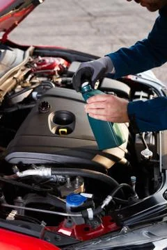 Checking and refilling the oil level in a modern car Stock Photos