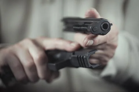 Checking, assembling and disassembling of 9 mm compact handgun Stock Photos