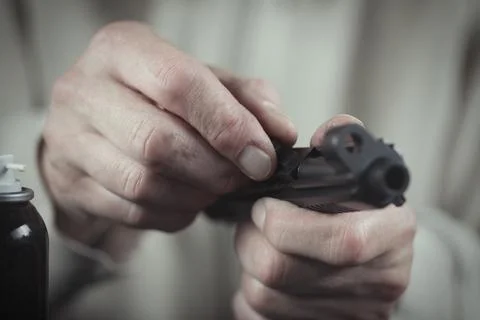 Checking, assembling and disassembling of 9 mm compact handgun Stock Photos