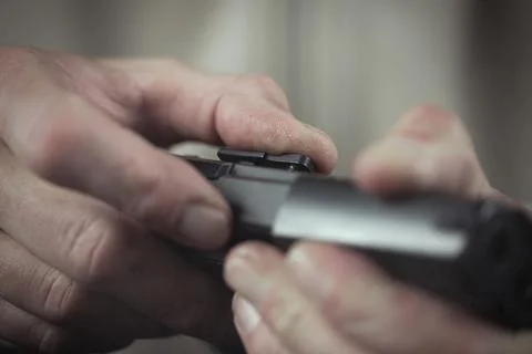 Checking, assembling and disassembling of 9 mm compact handgun Stock Photos